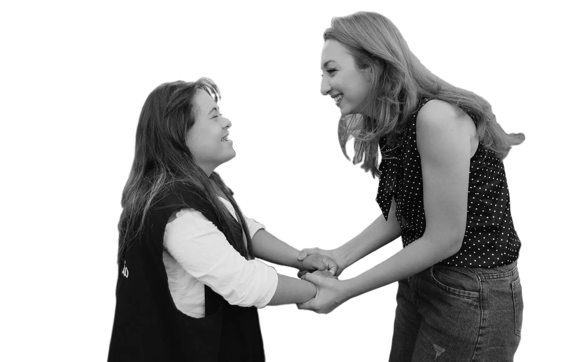 support worker holding hands with a girl with downsyndrome